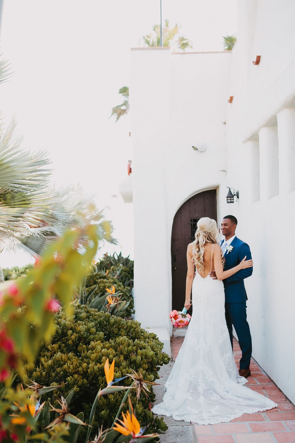 A romantic first look moment unfolds between newlyweds at Ole Hanson Beach Club in San Clemente