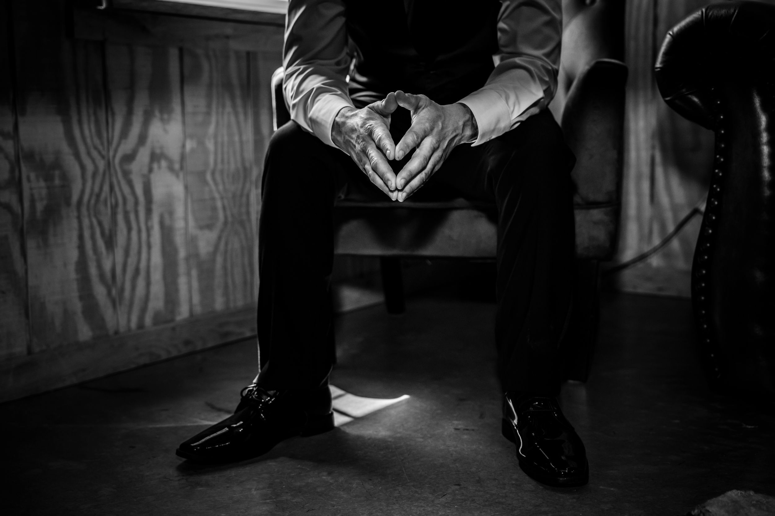 Dramatic black and white low angle shots focusing on formal footwear.
