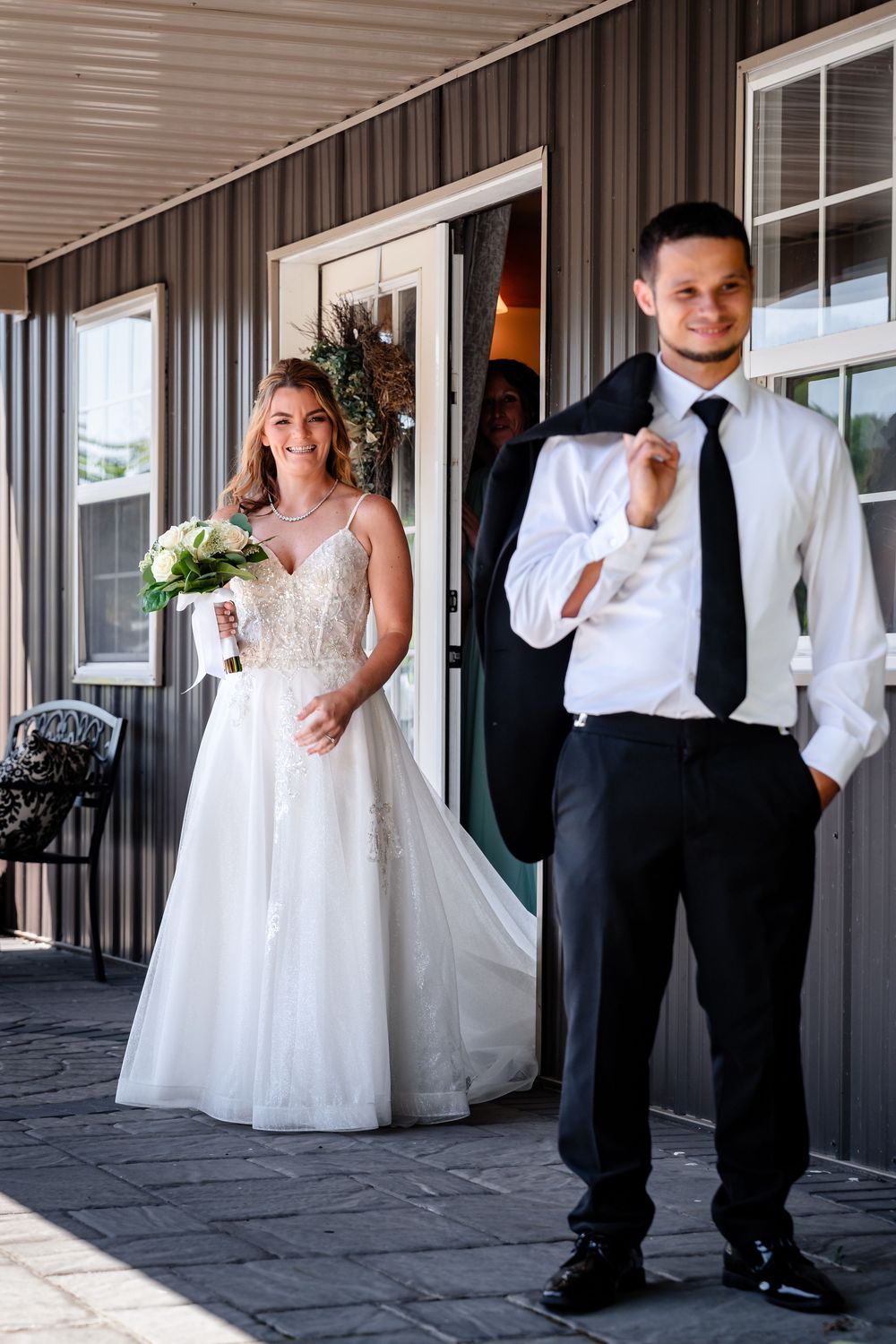 Series of joyful reactions during wedding day first look photos.