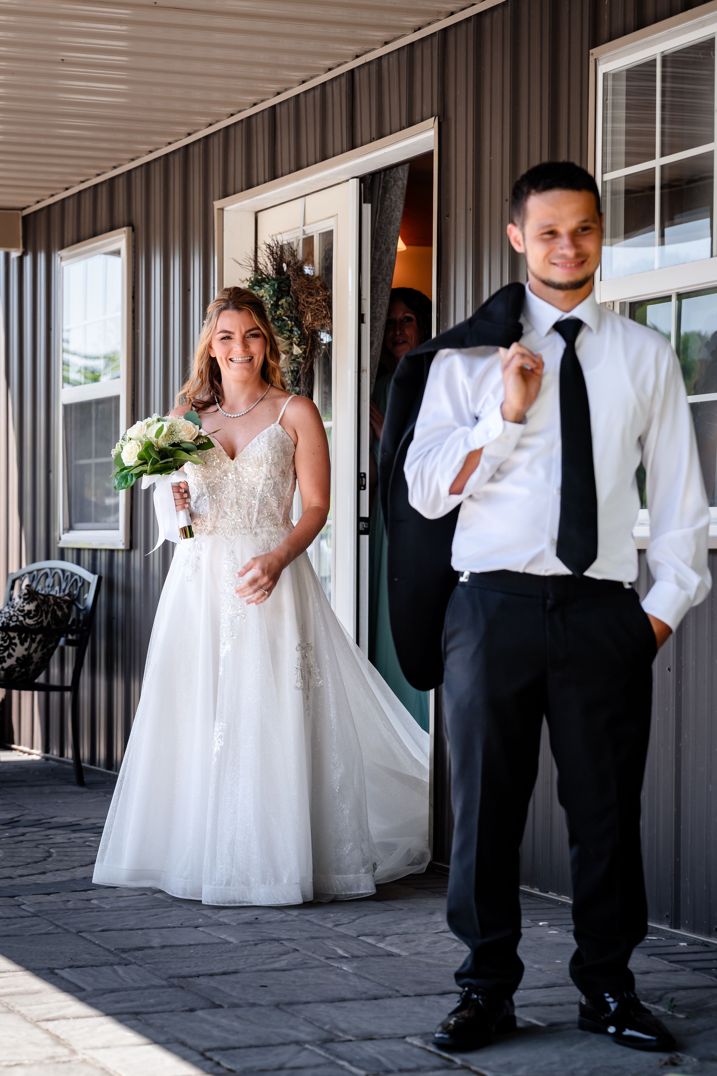 Series of joyful reactions during wedding day first look photos.