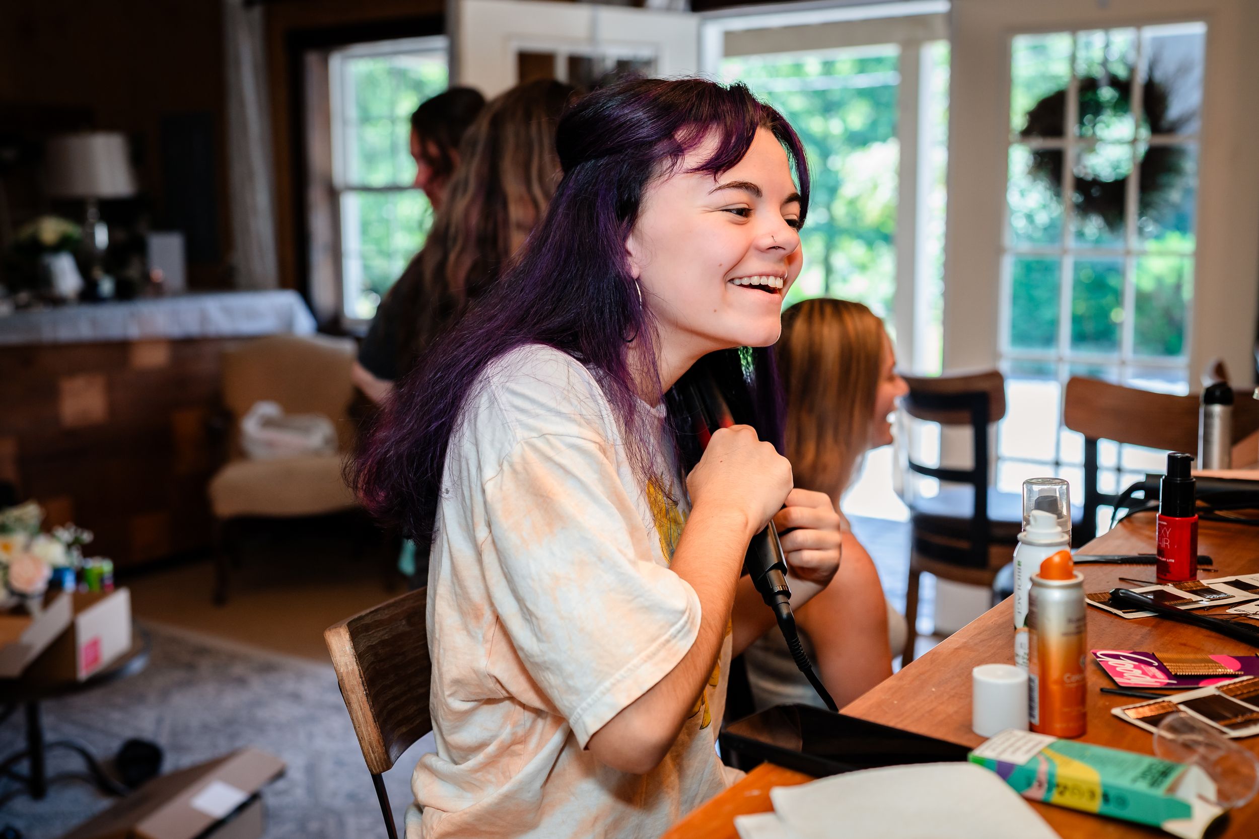 Candid moments of wedding morning preparations in a bright indoor setting.