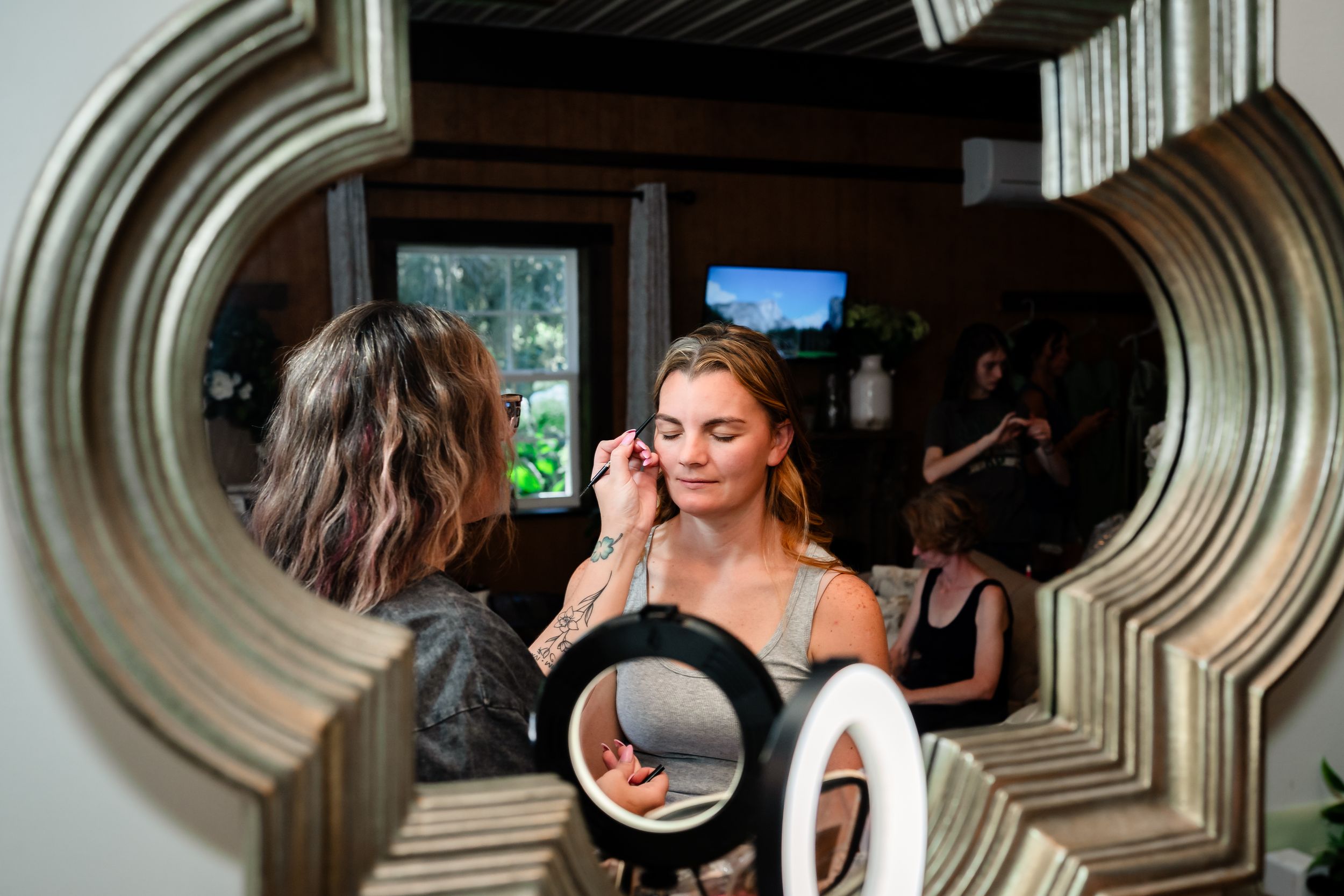 Wedding guests enjoying drinks and conversation at an elegant indoor reception.
