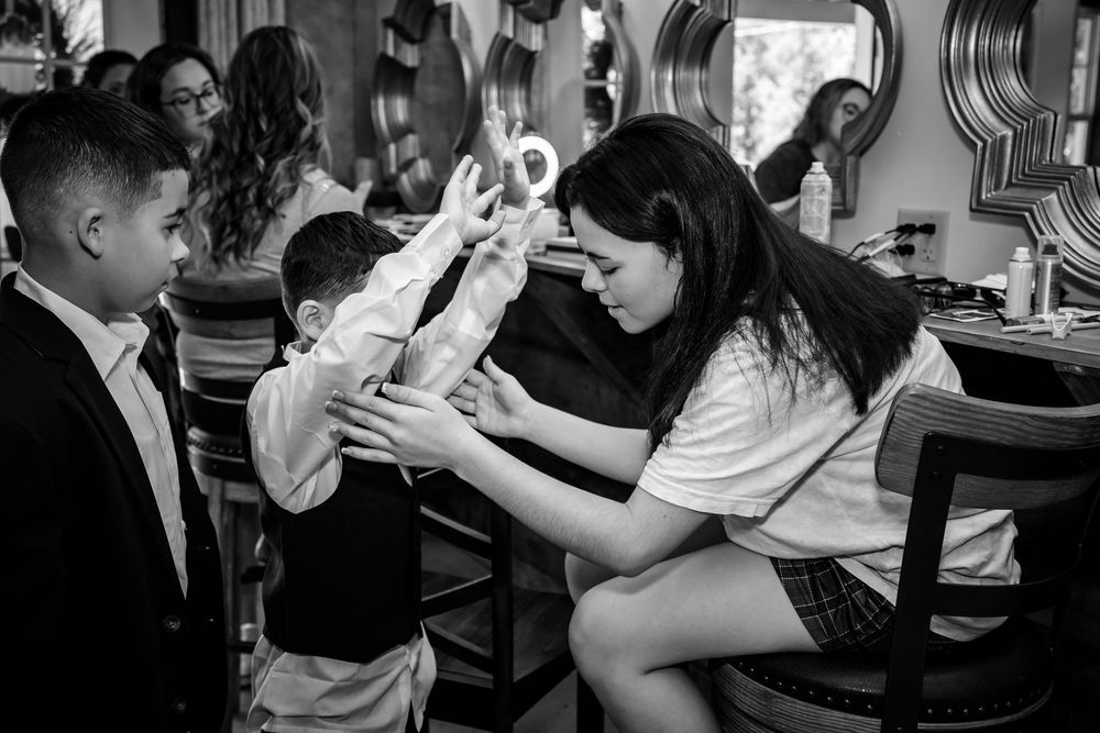 Black and white candid shots of guests mingling at a formal event.