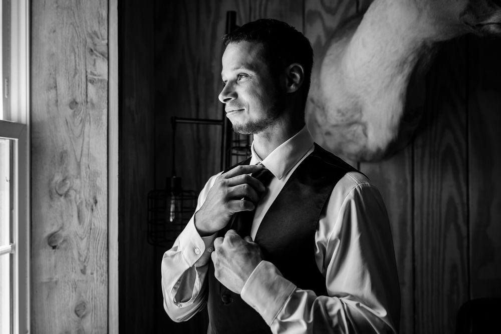 Black and white portraits showing moments of preparation before a formal event.