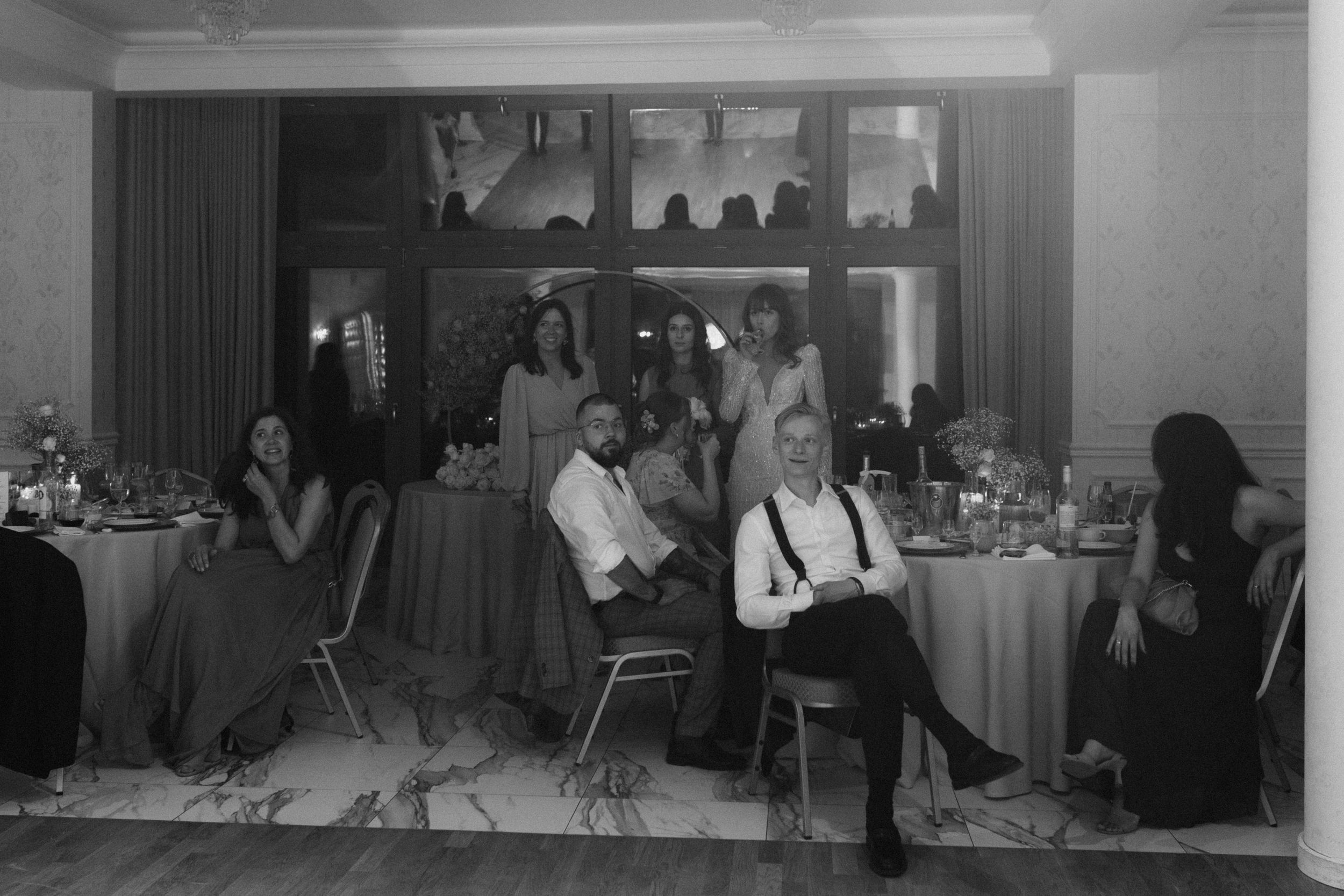Professional doctors and medical staff collaborating during a medical meeting in a hospital setting in black and white.