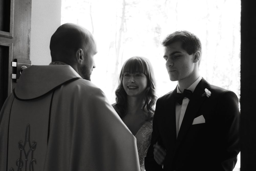 A series of black and white photographs showing people in conversation at what appears to be a professional gathering.