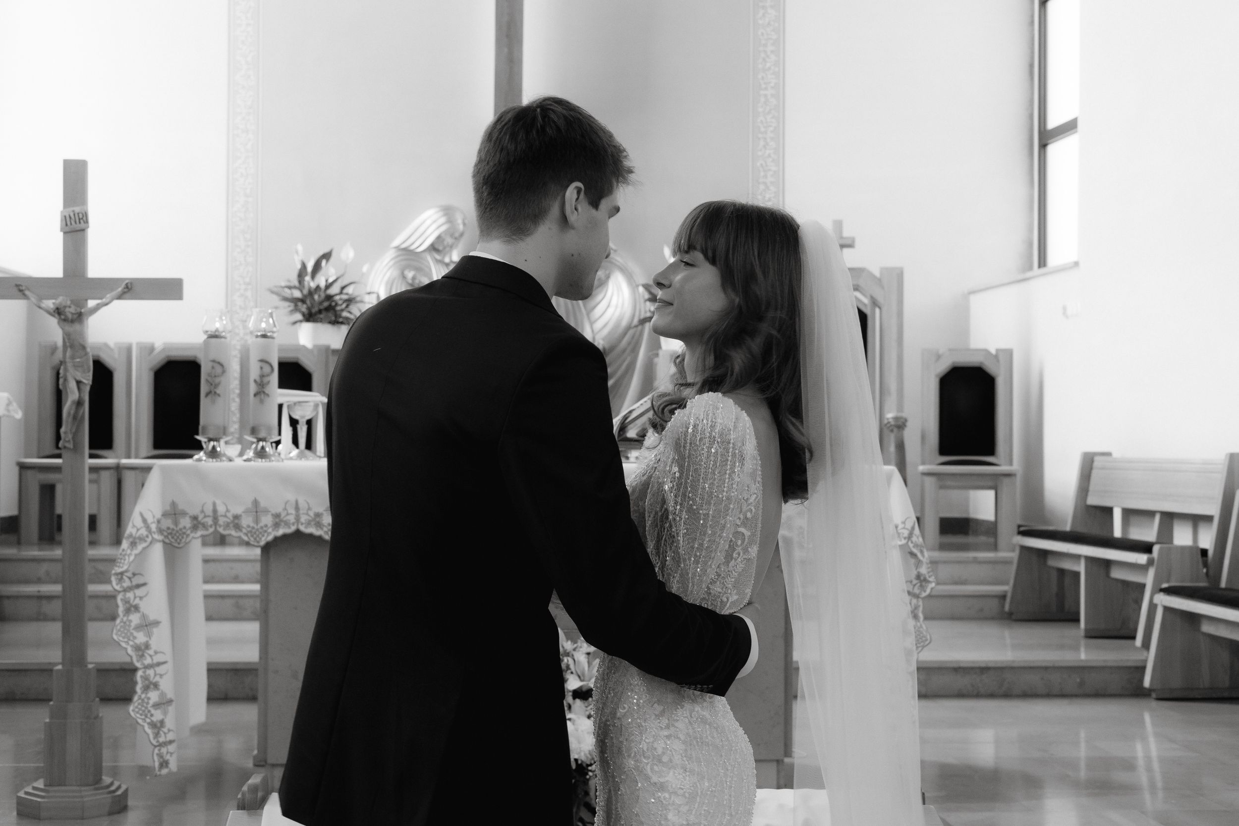 A series of black and white photos showing two people embracing and dancing in an intimate moment.