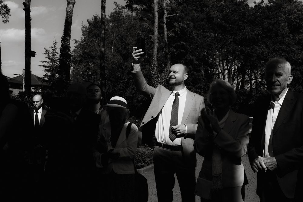 A collage of vintage black and white photographs showing people at a formal gathering outdoors.