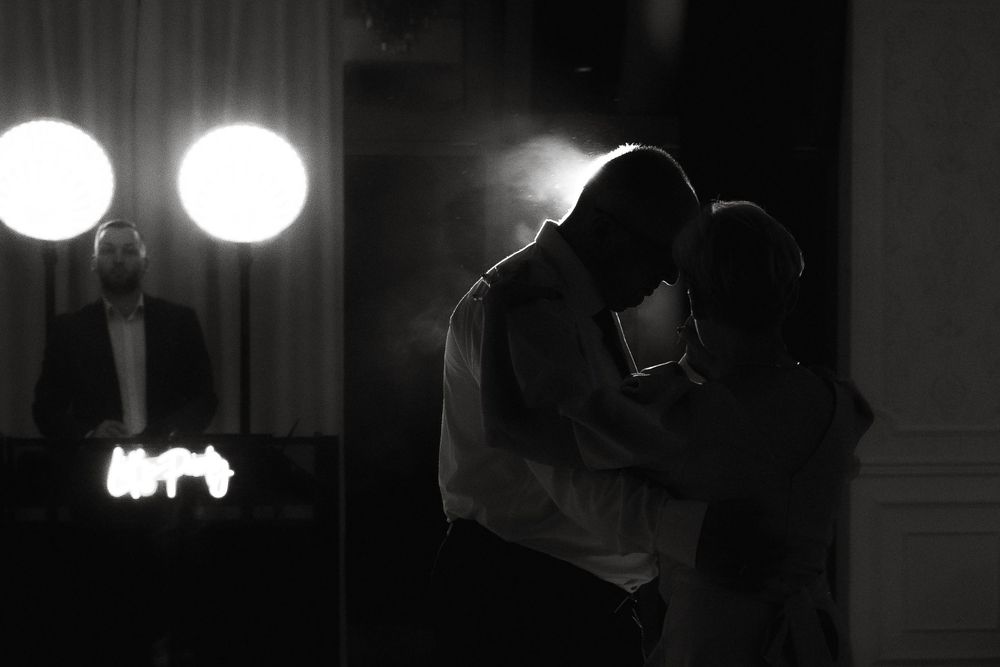 A collection of black and white film noir style shots showing dramatic lighting and silhouettes in a dark hallway.