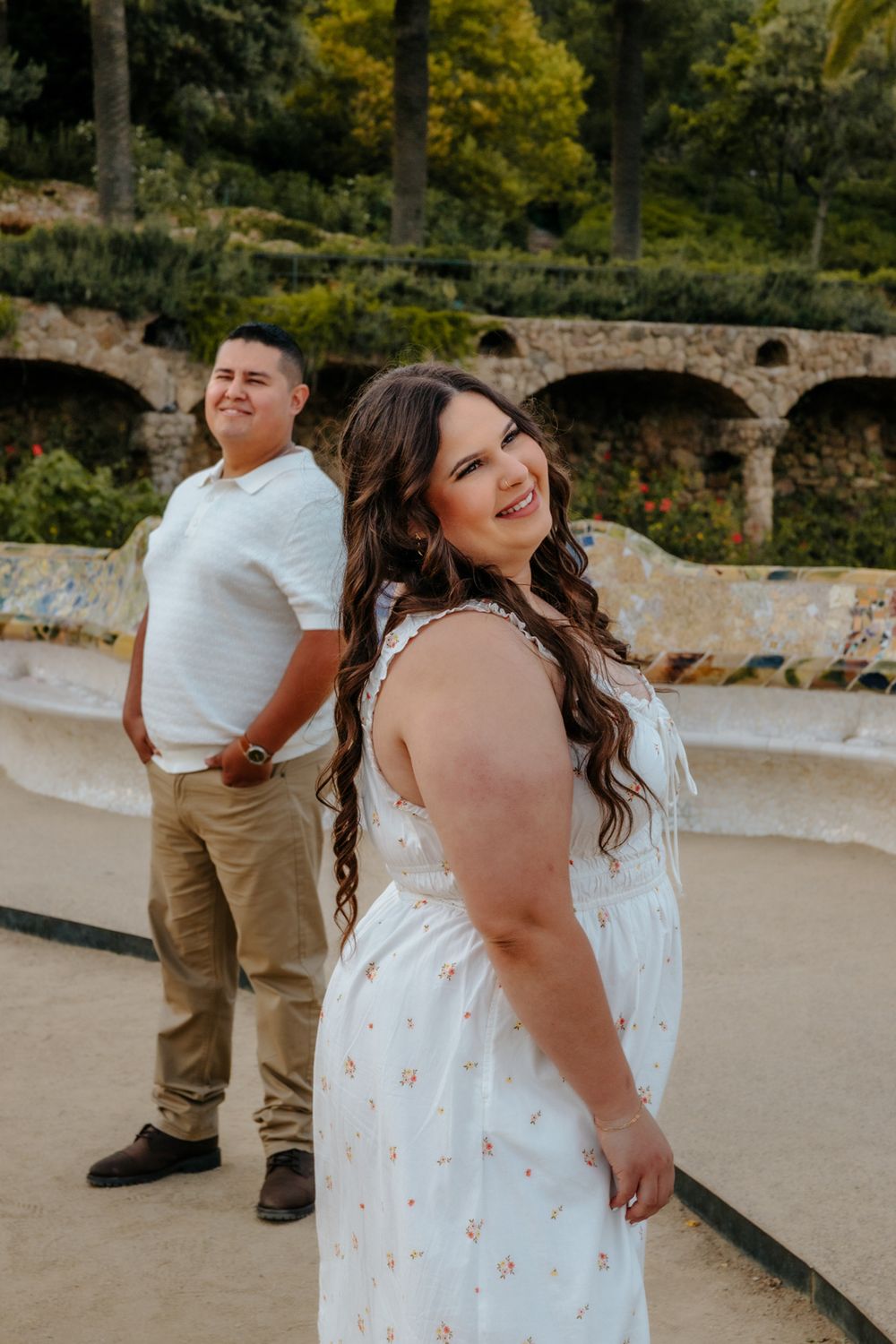 Couple enjoying a quiet moment on a scenic terrace in Park Güell.