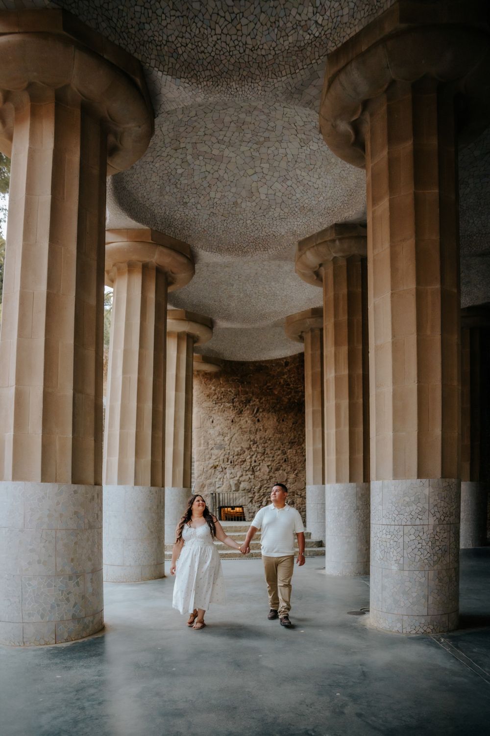 Candid laughter of the couple during their romantic photoshoot in Park Güell.