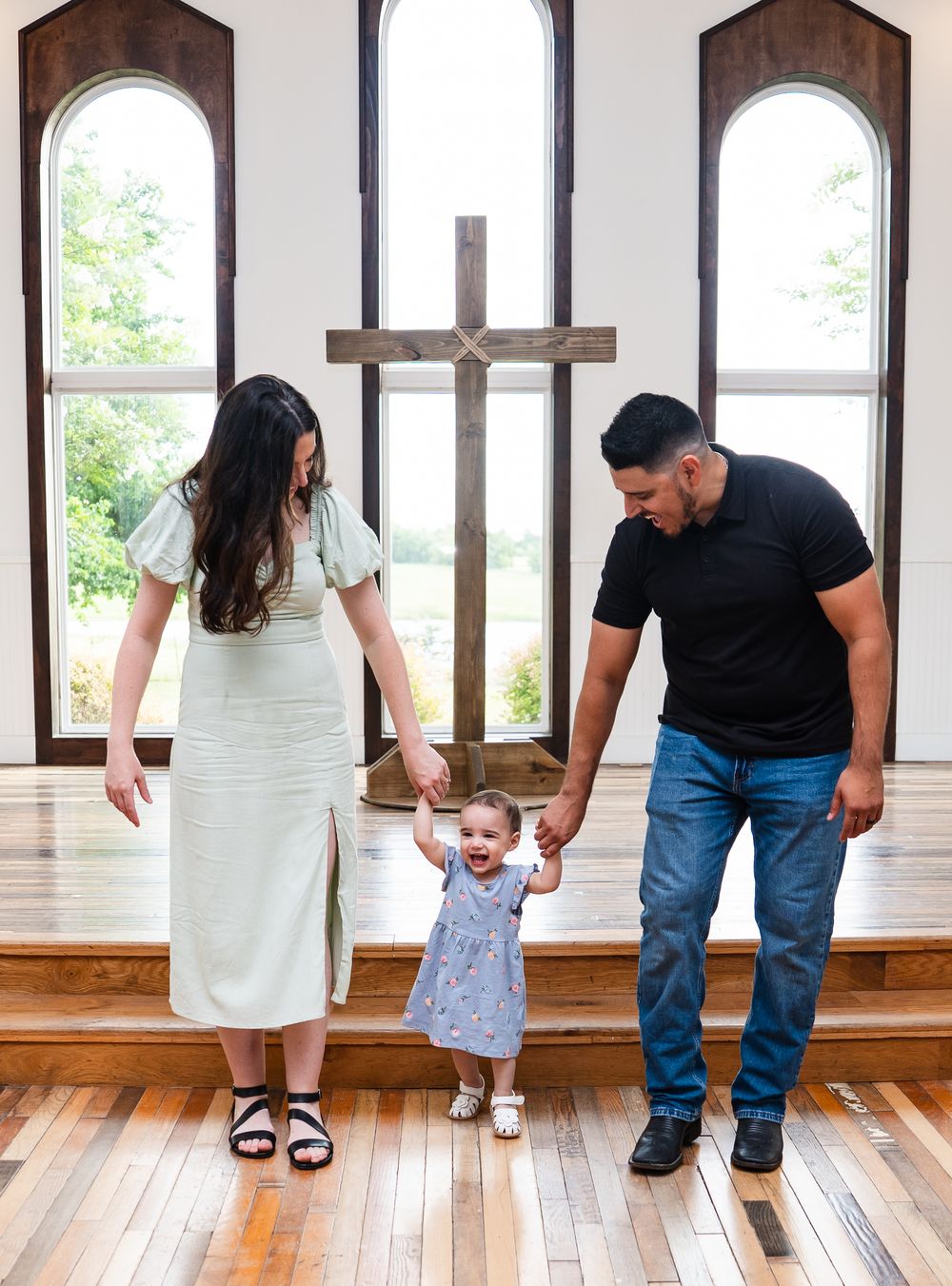 A series of progressive photos showing parents holding their young child's hands while walking together on a hardwood floor.