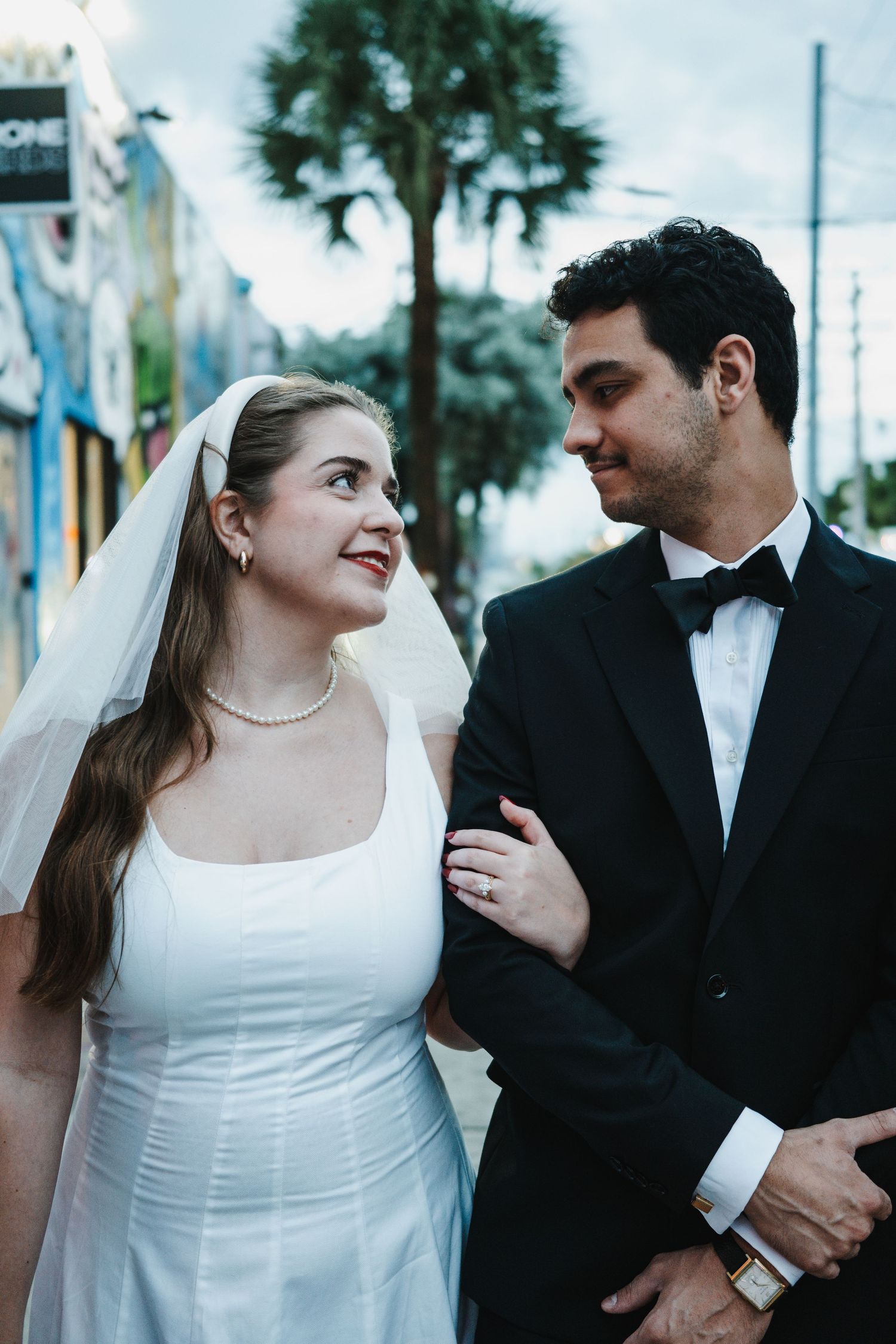 Black and white sequence of a laughing bride and groom sharing joyful candid moments together on their wedding day.
