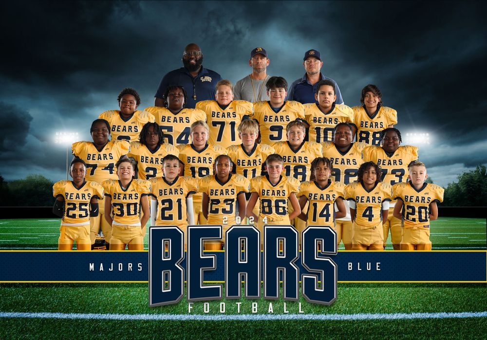 Football team photo with players in gold uniforms on field under stormy sky.