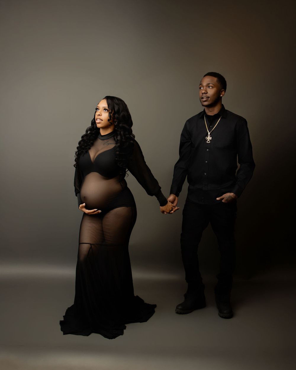 A compositional sequence of black and white maternity portraits showing intimate moments against a dark backdrop.