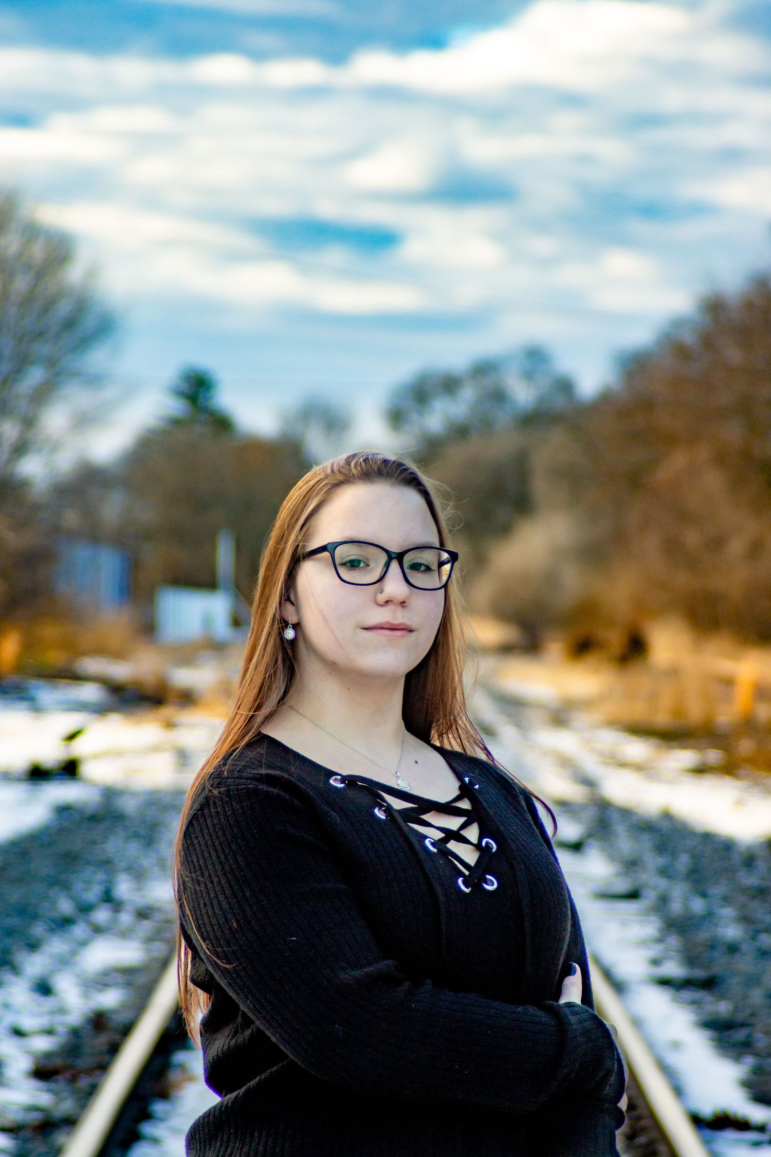 Senior on stark winter day on railroad tracks in Canal Winchester, Ohio by Jamie Macey Photography