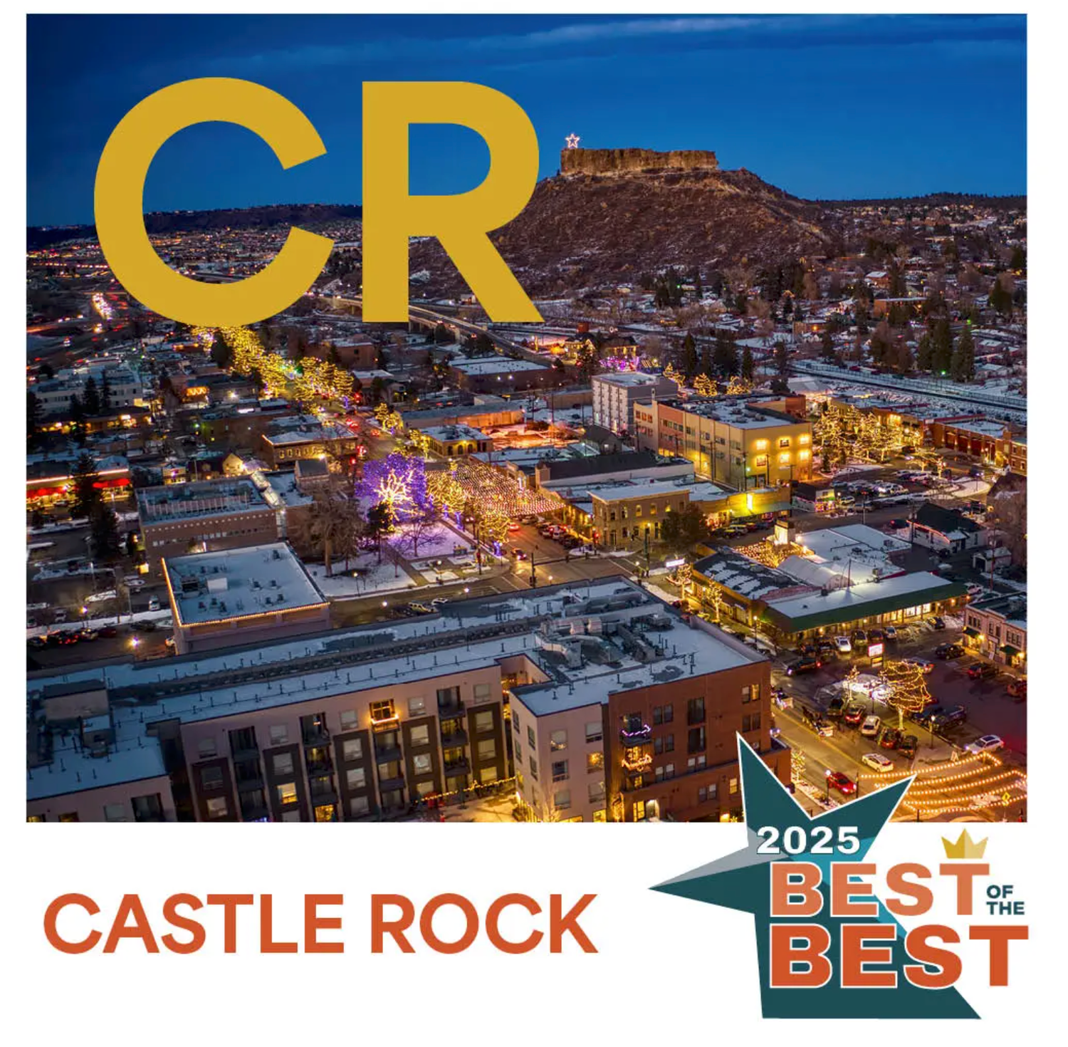 Aerial view of downtown Castle Rock Colorado illuminated at dusk with yellow CR letters and Best of Best 2025 badge.