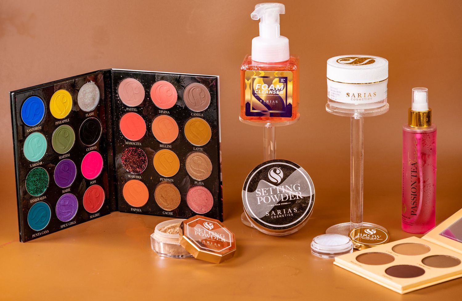 A vibrant panoramic collage of colorful cosmetic makeup palettes and beauty products arranged in a series.