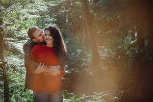 A romantic forest photography session with soft lighting and intimate poses.