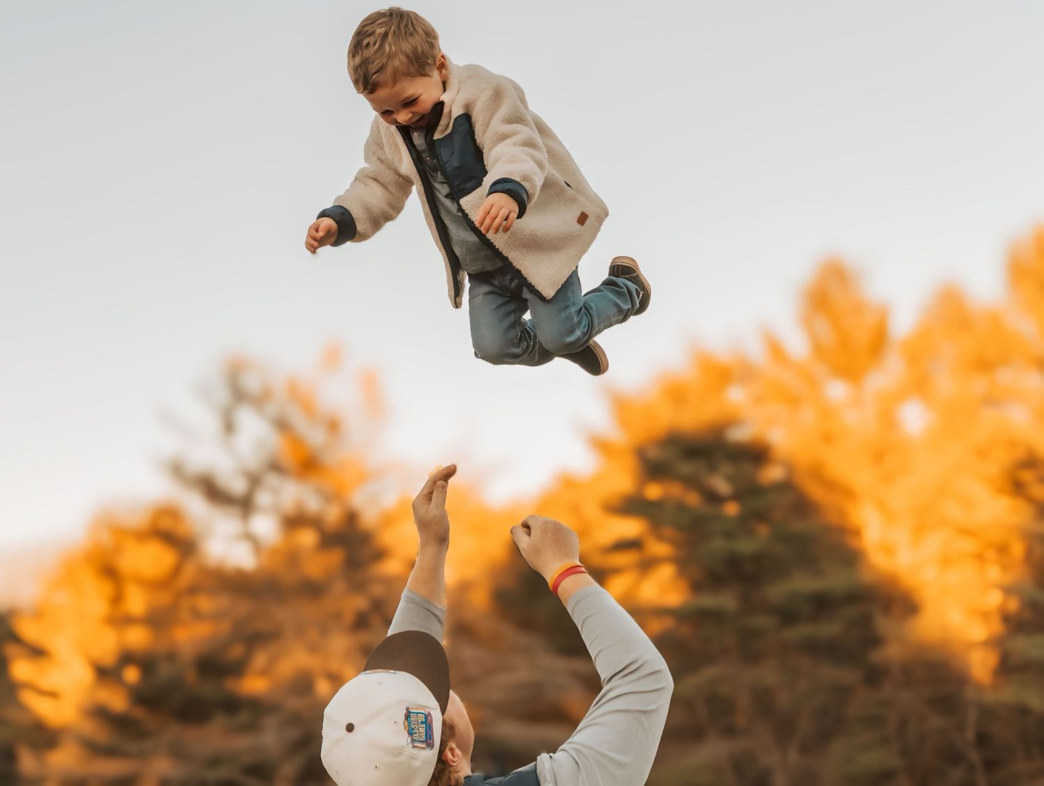 Toddler being thrown in the air in Maine