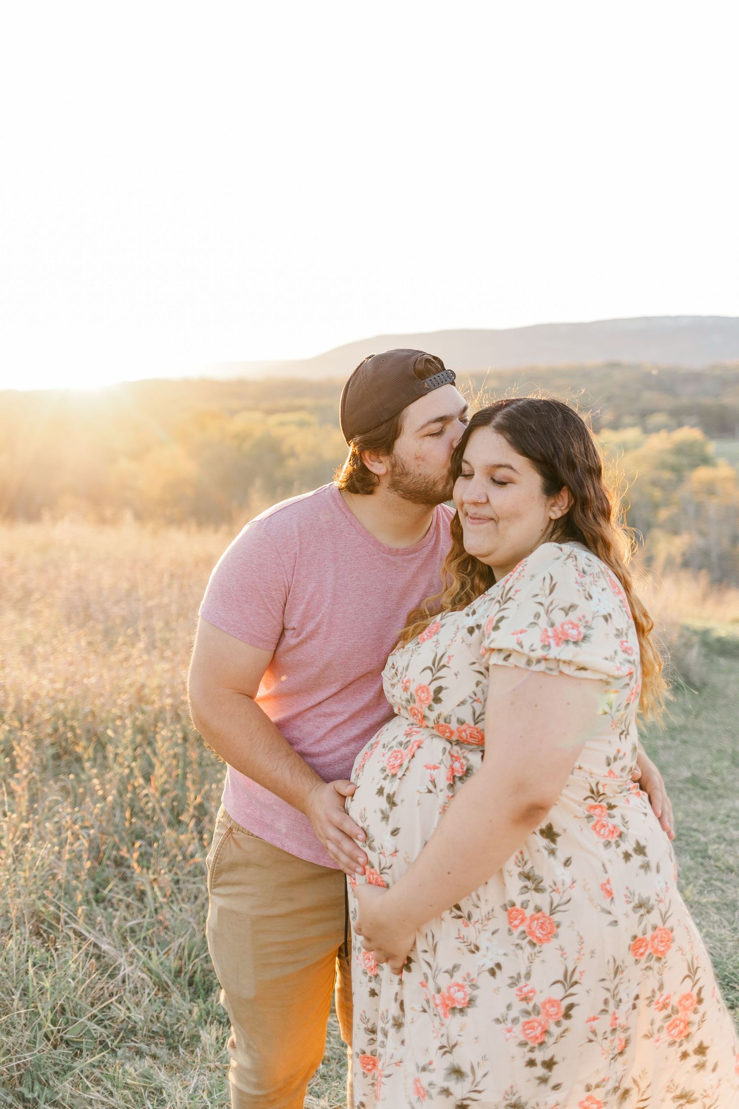 Couple kissing at golden hour during a maternity session, Gardiner, NY