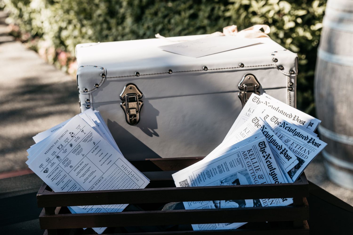 Vintage white cooler with event tickets and clasps.