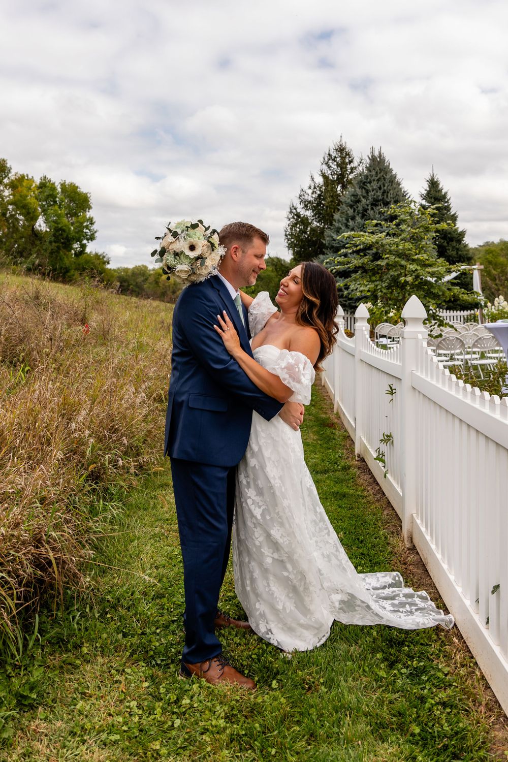 Wedding couple at their garden summer wedding in Omaha, Nebraska. - BrightSide Photography
