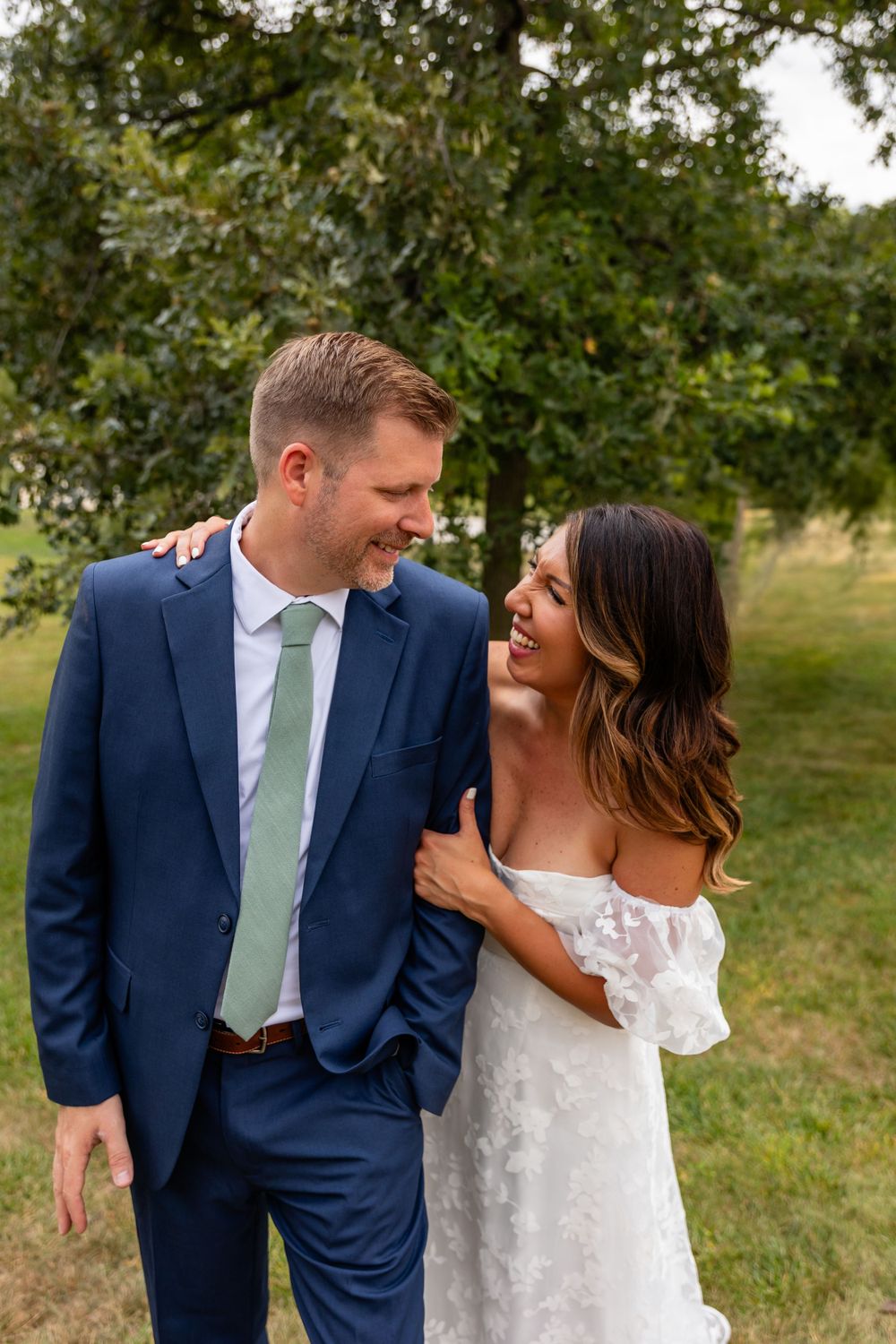 Wedding couple at their garden summer wedding in Omaha, Nebraska. - BrightSide Photography