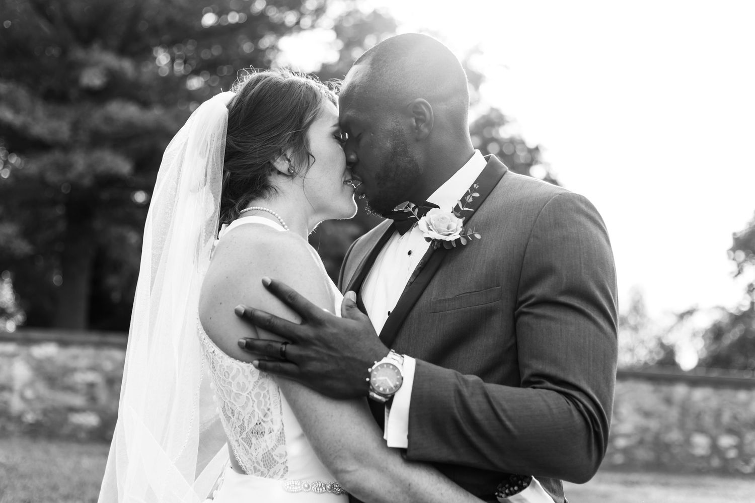 Black and white wedding portrait capturing tender moment between newlyweds in Central Pennsylvania.
