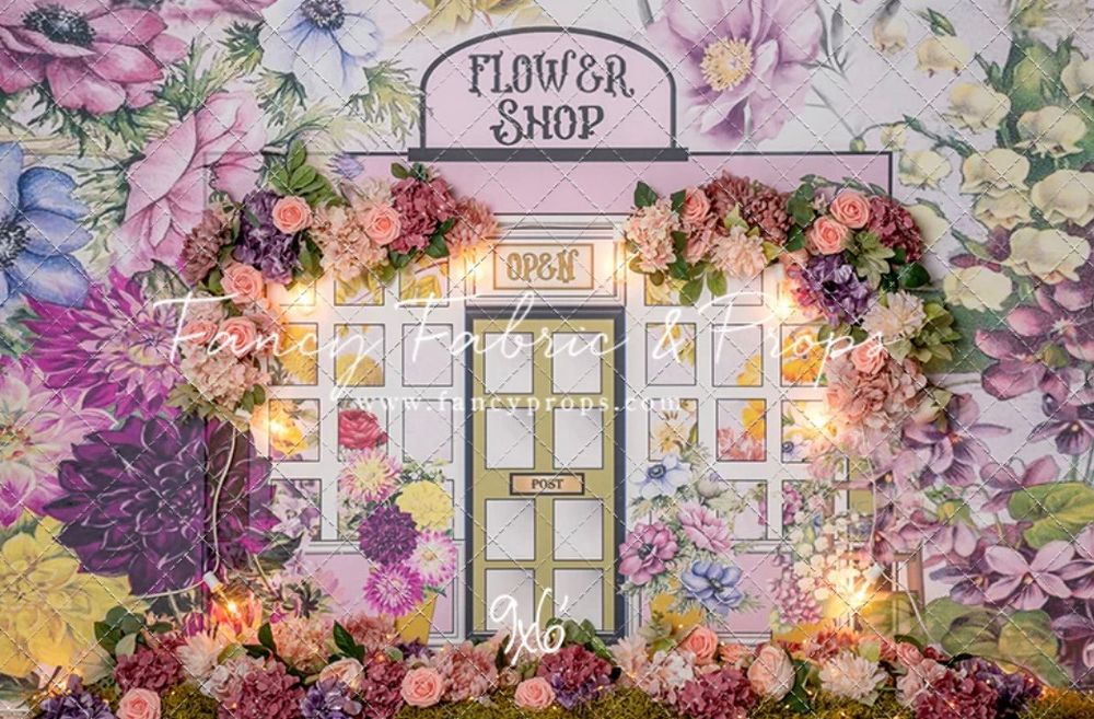 Enchanting flower shop storefront decorated with pink and purple blooms and twinkling lights.