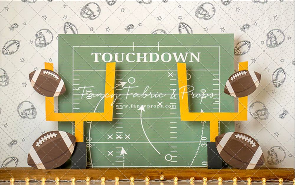 Chalkboard showing football touchdown play diagram with footballs and yellow goal post decorations against textured background.
