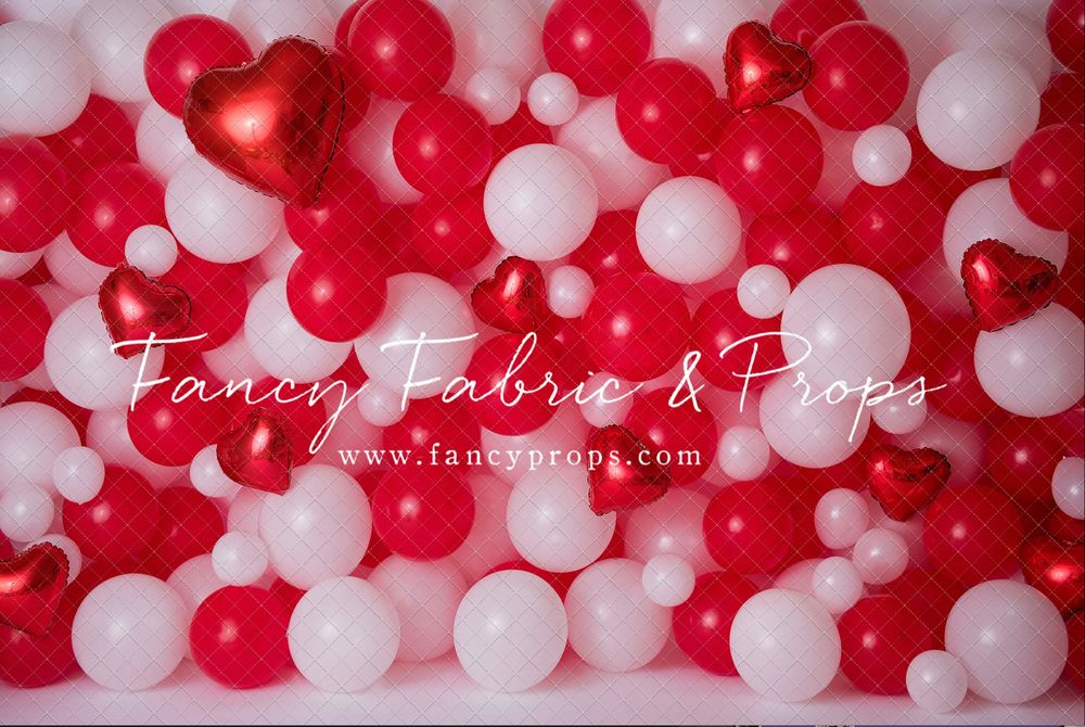 Red and white balloons create a festive backdrop for Valentine's Day or holiday party decorations.