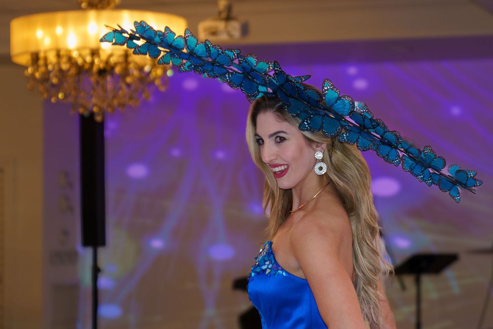 Model strutting runway in elegant gown at fashion show, dynamic event photography by SRX Media Group