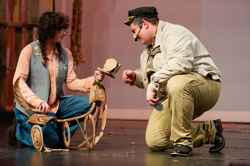 High school students performing on stage during a school play, colorful theater lights and expressions captured by SRX Media Group.