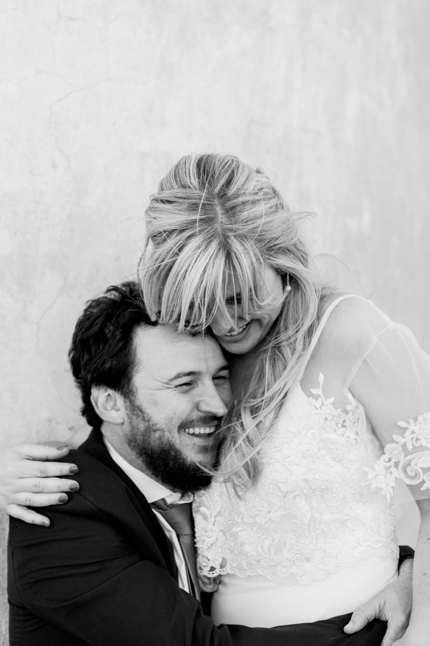Black and white wedding photography sequence showing romantic candid moments.