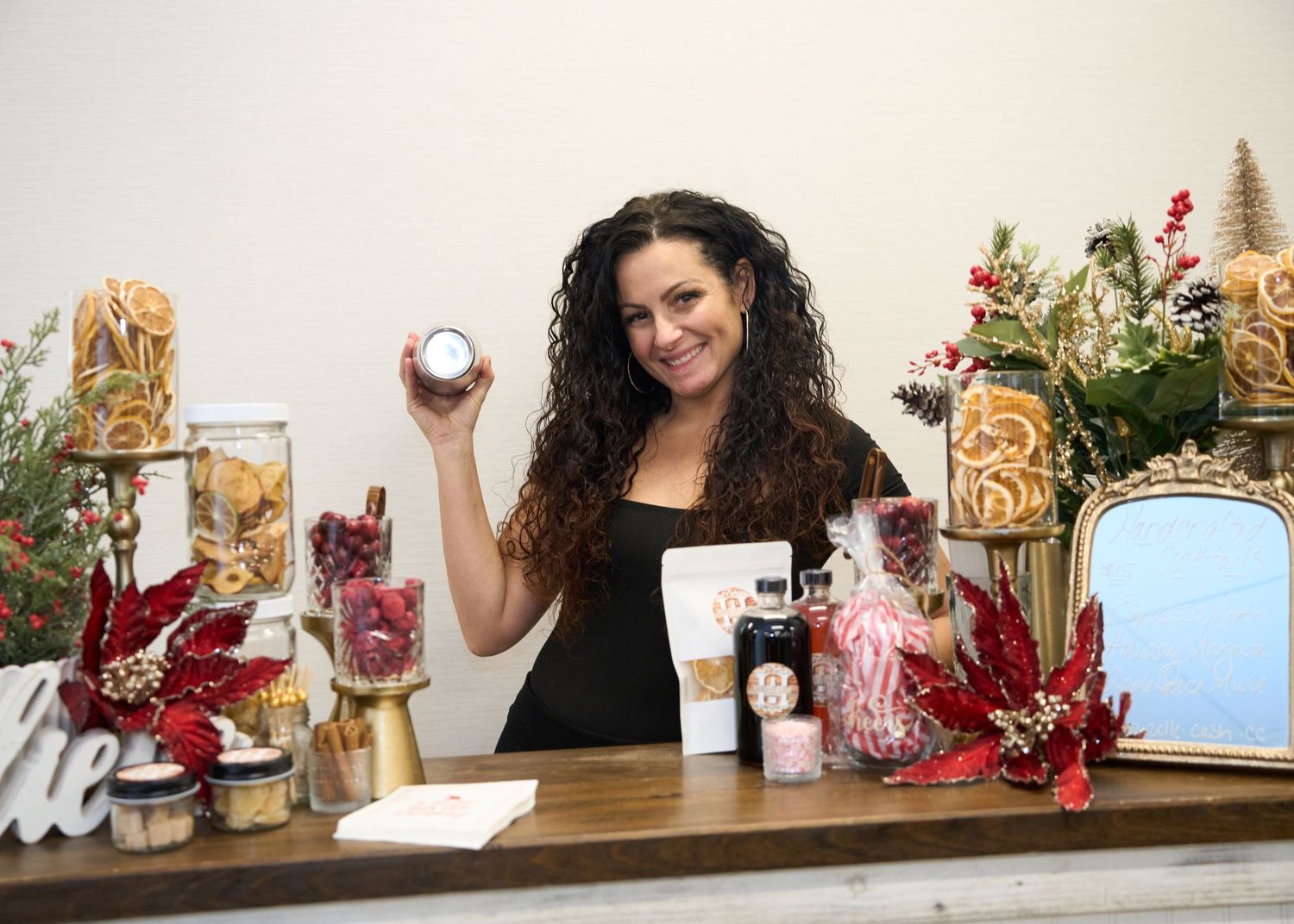 A female bartender onsite at corporate holiday event.