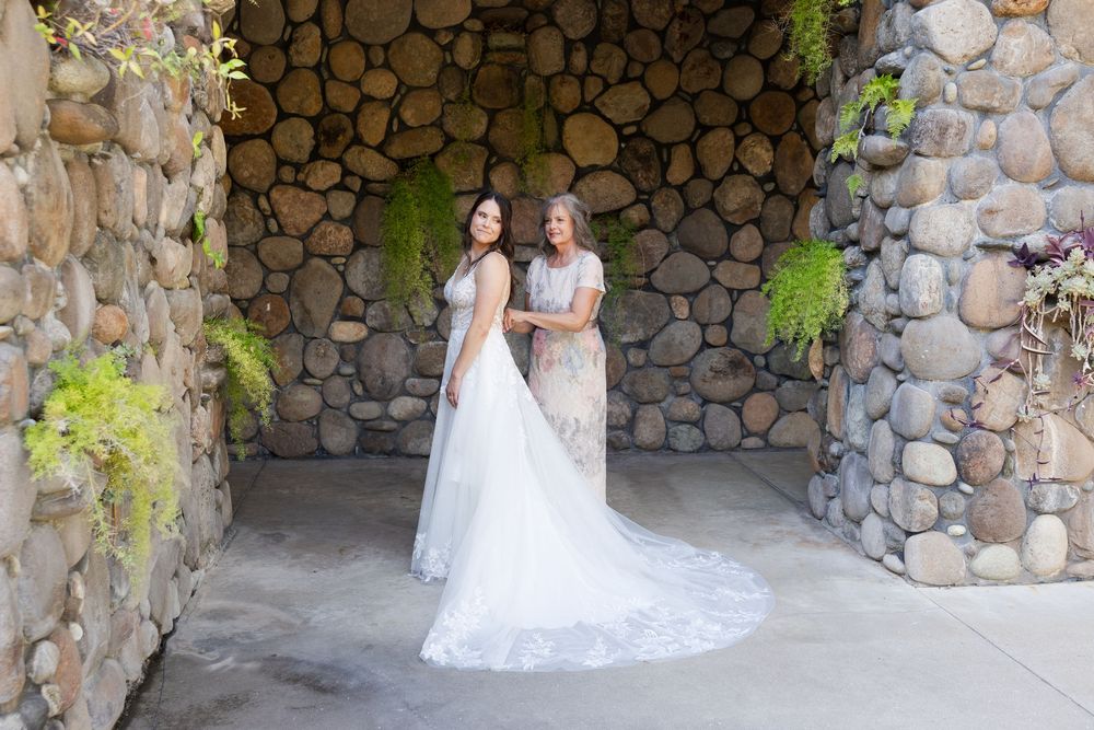 Wedding venue features beautiful stone wall architecture with natural lighting and elegant details.