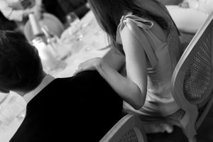 Black and white photo collage showing a person reading a book in multiple different poses and positions.