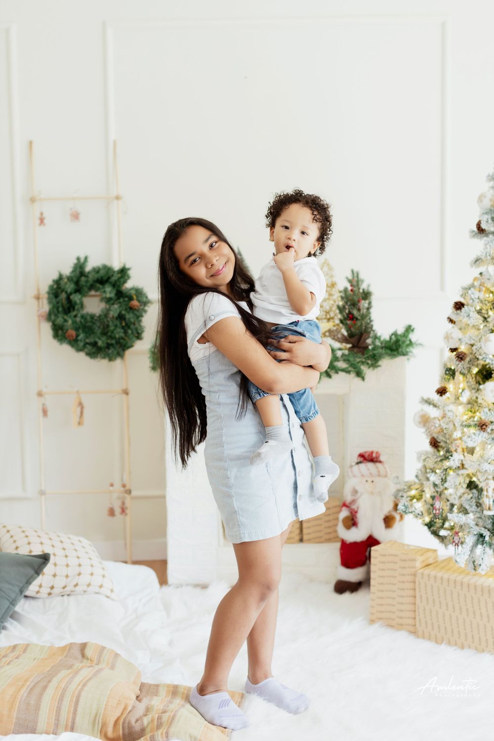 A cozy Christmas scene with holiday decorations including a decorated tree, wreaths, and a festive setting.
