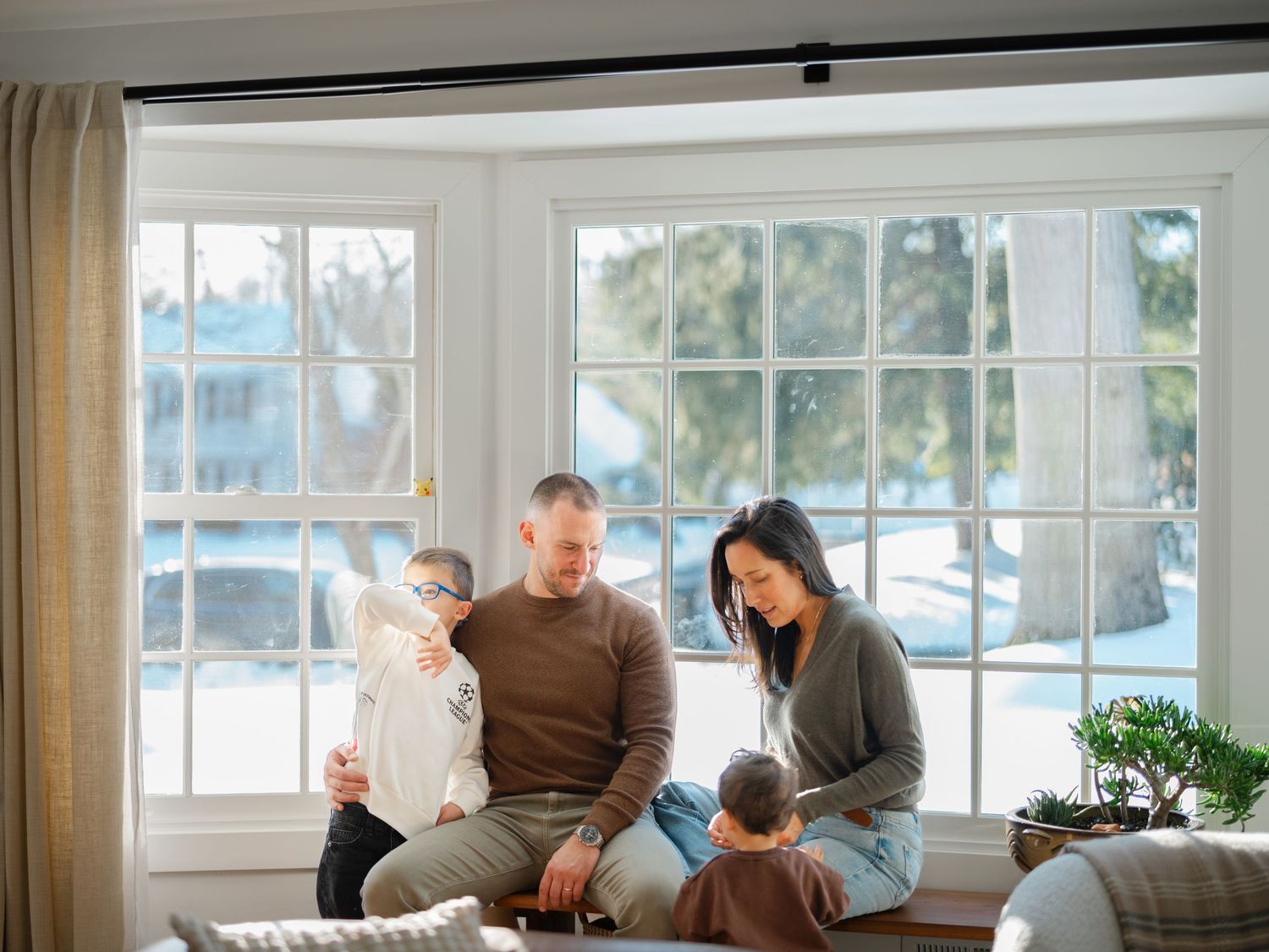 Authentic family photography capturing playful moments at home in New Jersey.