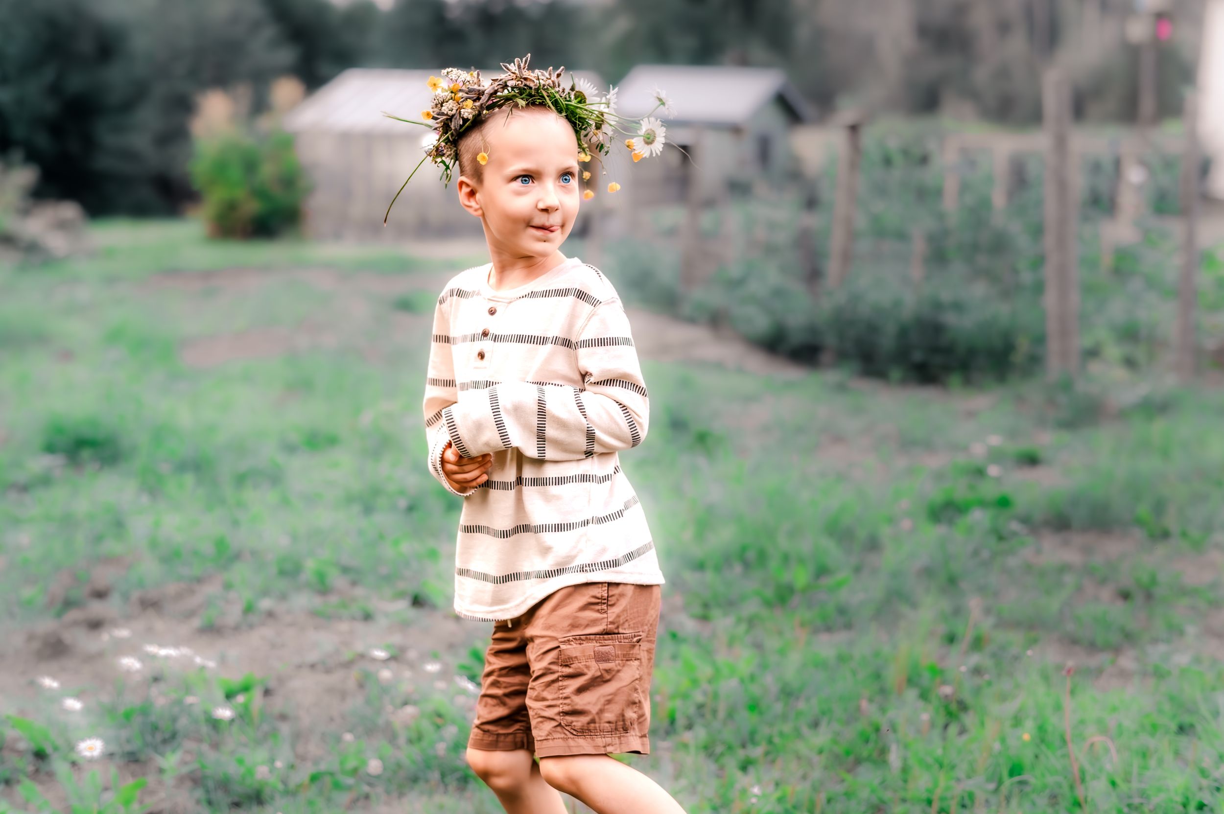 A series of candid photos showing a toddler in a striped shirt playing outdoors in a grassy field.