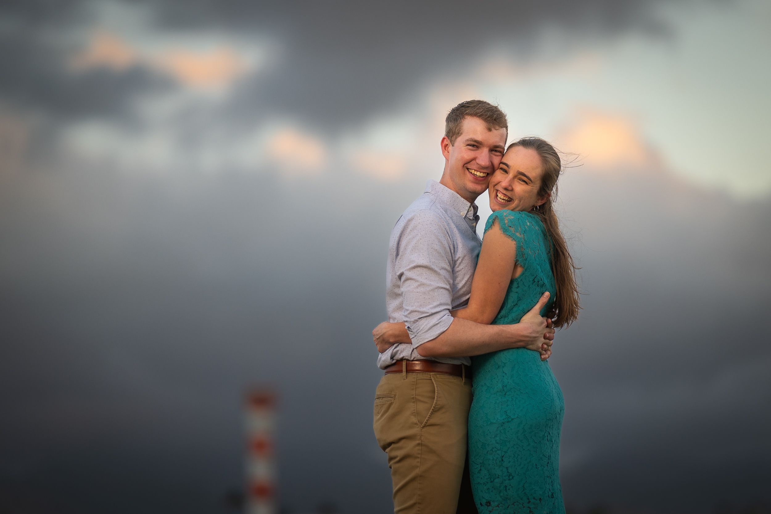 Loving married couple so happy and smiling on Ford Island for a couples anniversary photo session with Jenna Ettlich