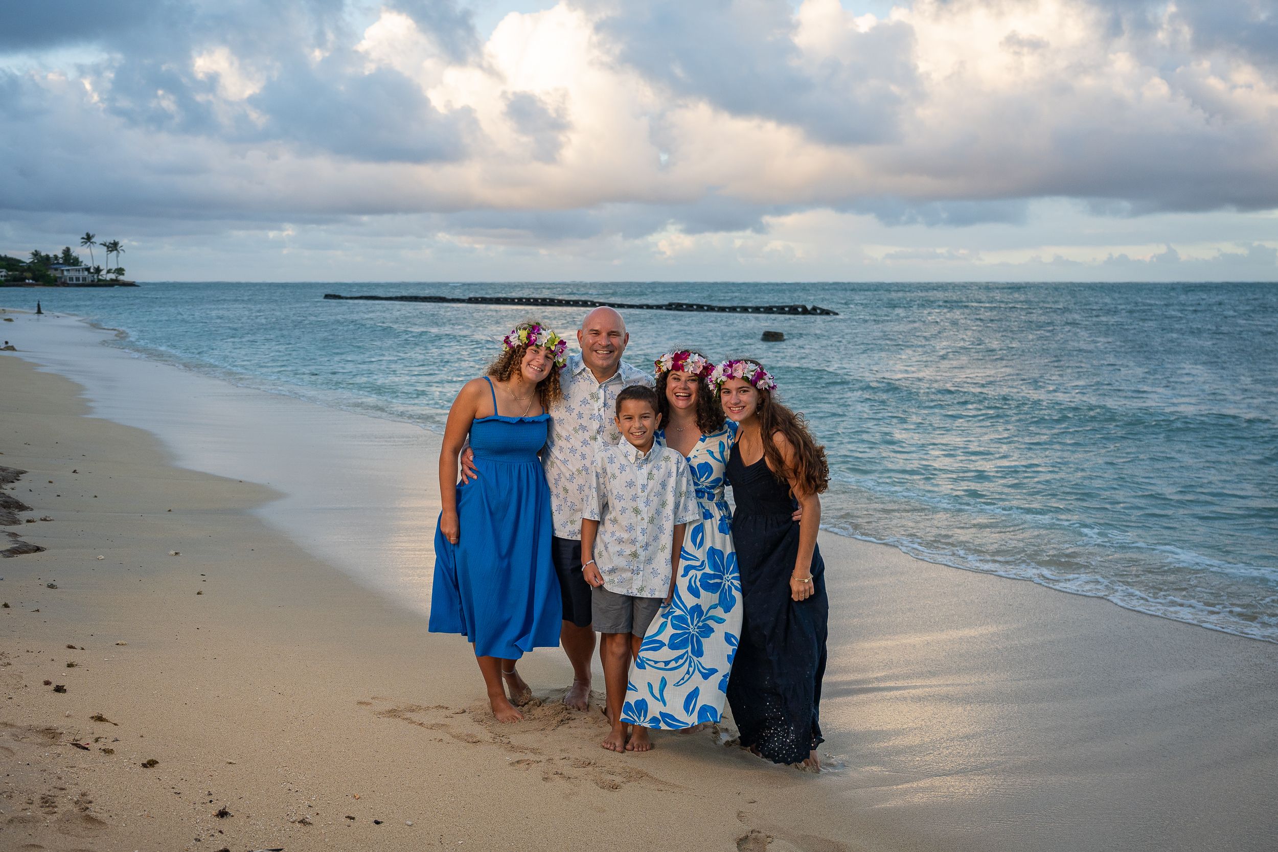 U.S Air Force Family of five at Kualoa Regional Park Beach in Kaneohe, Oahu, Hawaii for fun and memorable family pictures, casual and candid