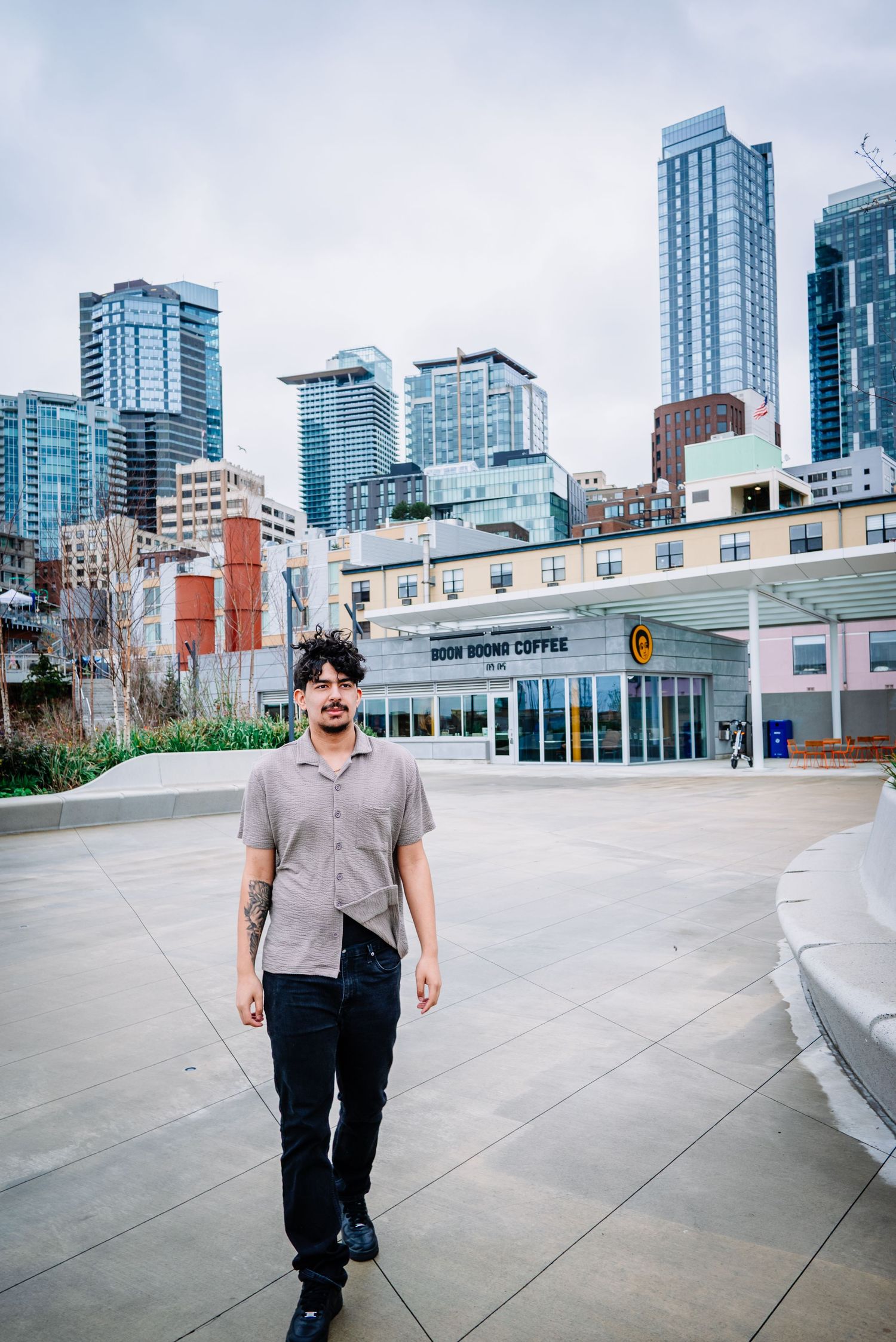 Senior graduation portrait walking along Pier 62 on the Seattle waterfront