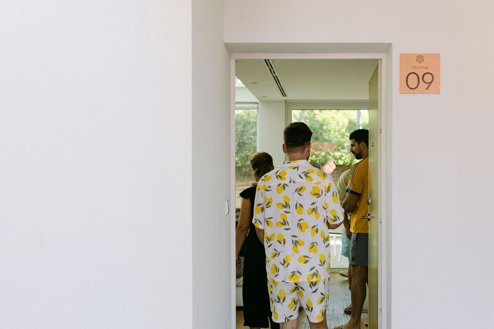 Guests arriving at Onyria Quinta da Marinha hotel room before wedding preparations in Cascais, Lisbon.