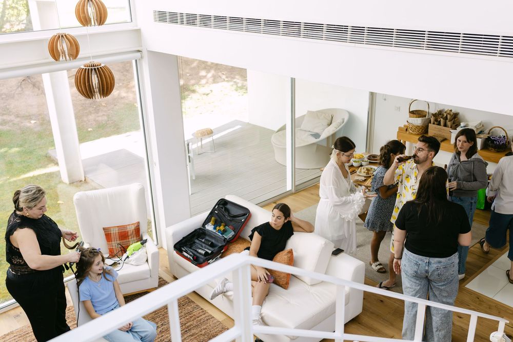 Overhead documentary view of bride’s preparations inside modern villa in Cascais, Portugal.
