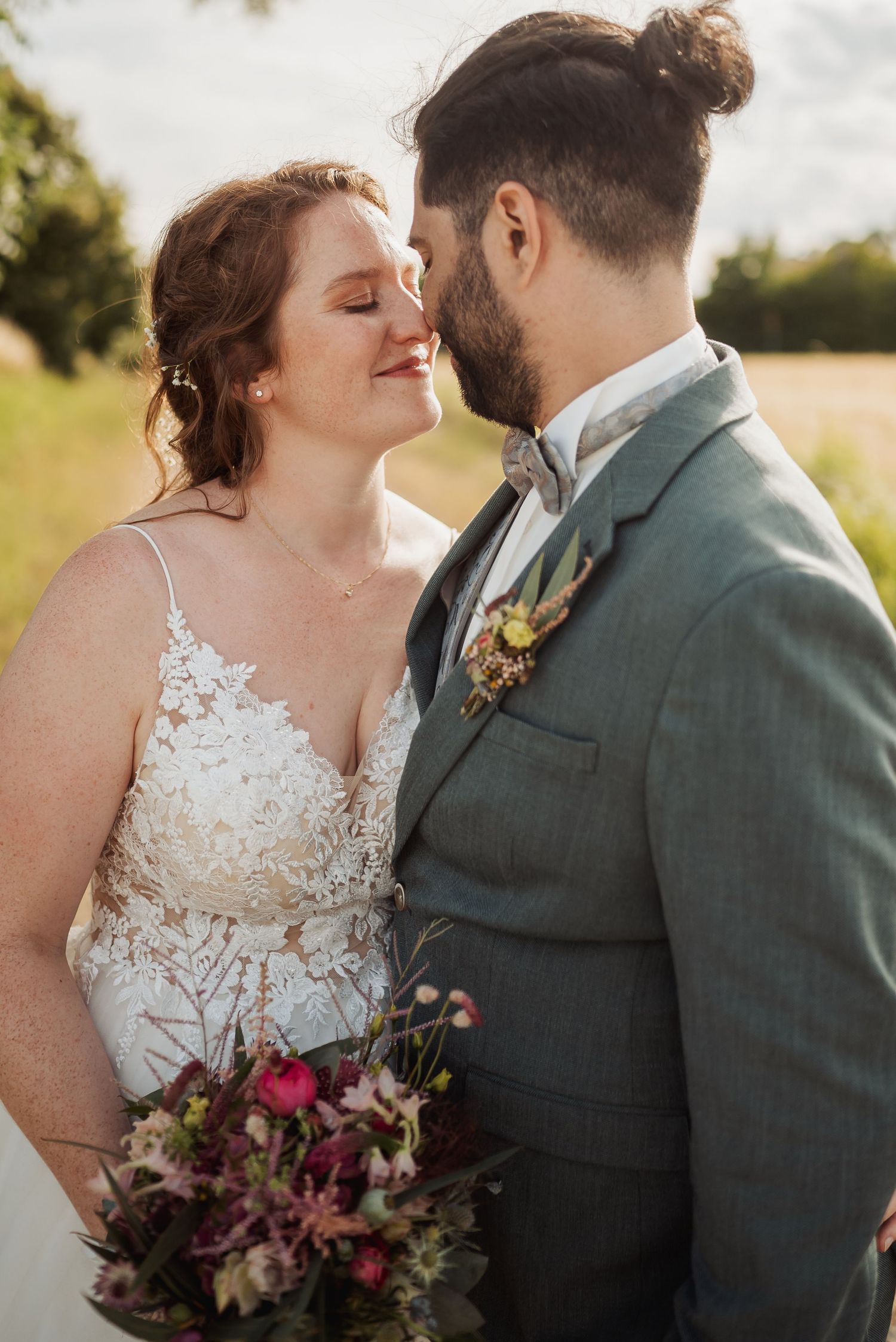 A romantic wedding moment captured in a series of intimate close-up shots showing a couple embracing in golden sunlight.