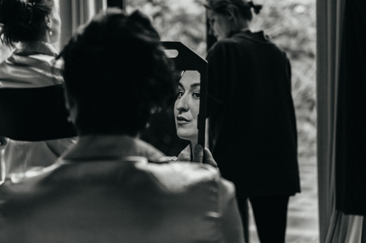 A black and white photo sequence shows a couple in a romantic embrace on a train platform.