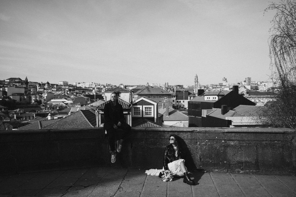 Vintage black and white photographs showing urban landscapes and buildings in a panoramic view.