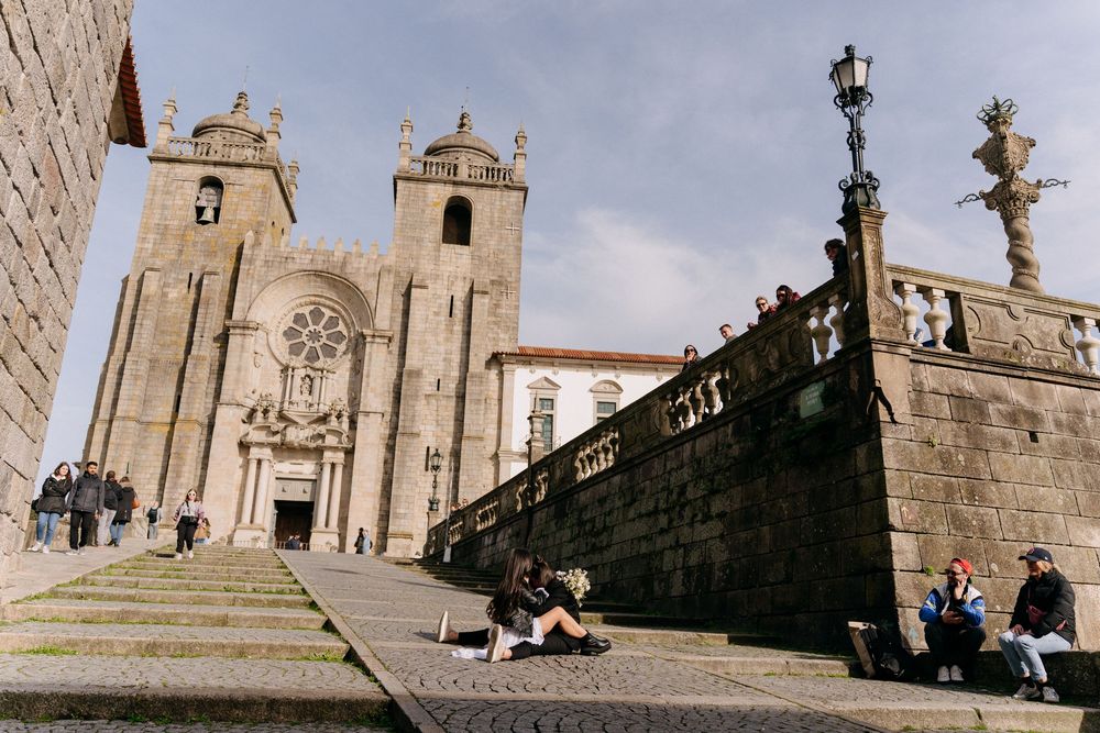 Historic church towers and architectural details against a bright sky in an old European city.